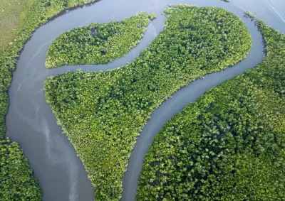 Aerial image of a coastal ecosystem of waterways and mangroves. (c) Commonwealth of Australia (Reef Authority), photographer B. Smith